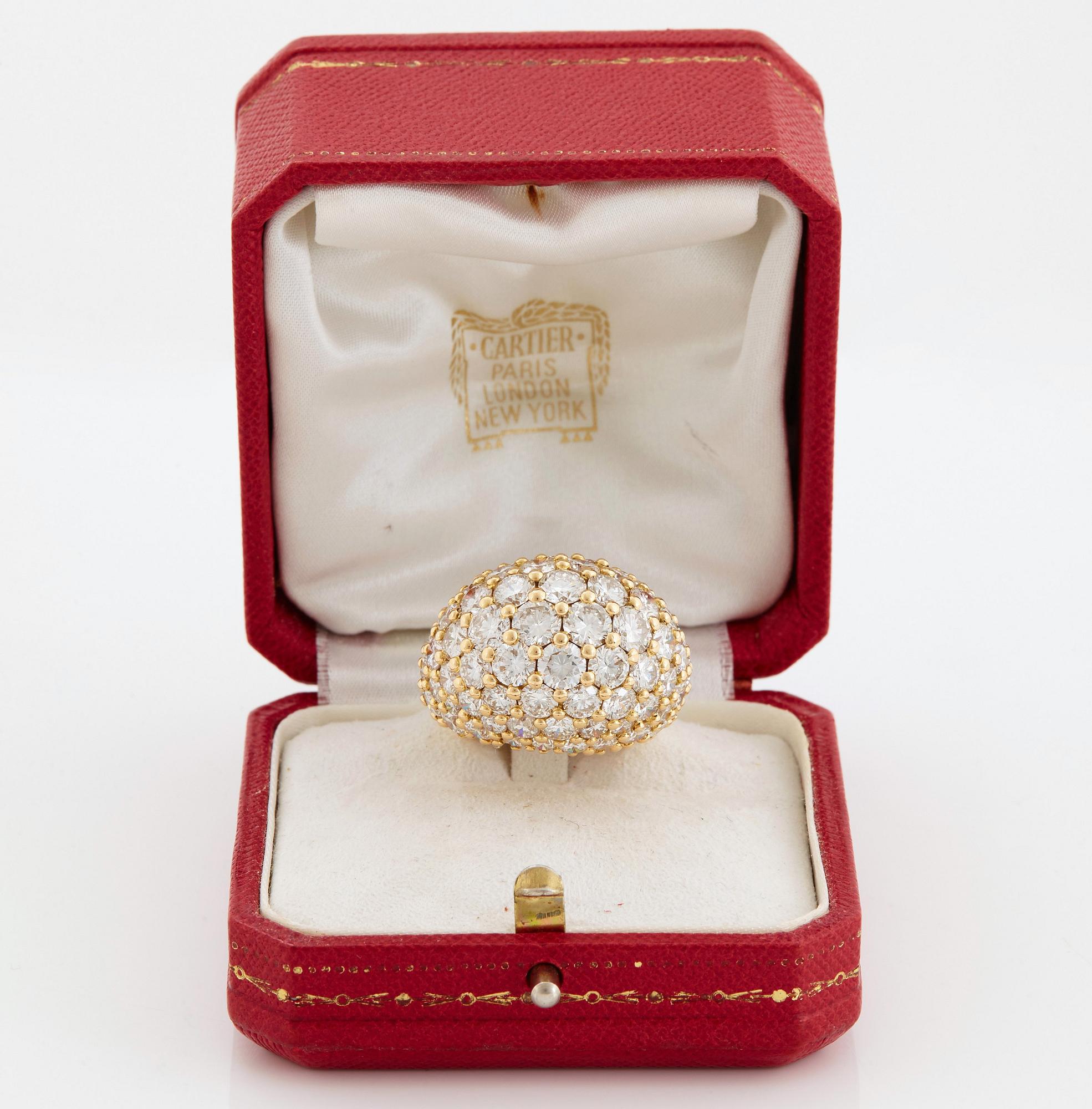 Cartier "Marrakech" an 18K gold bombé ring set with round brilliant-cut diamonds.
