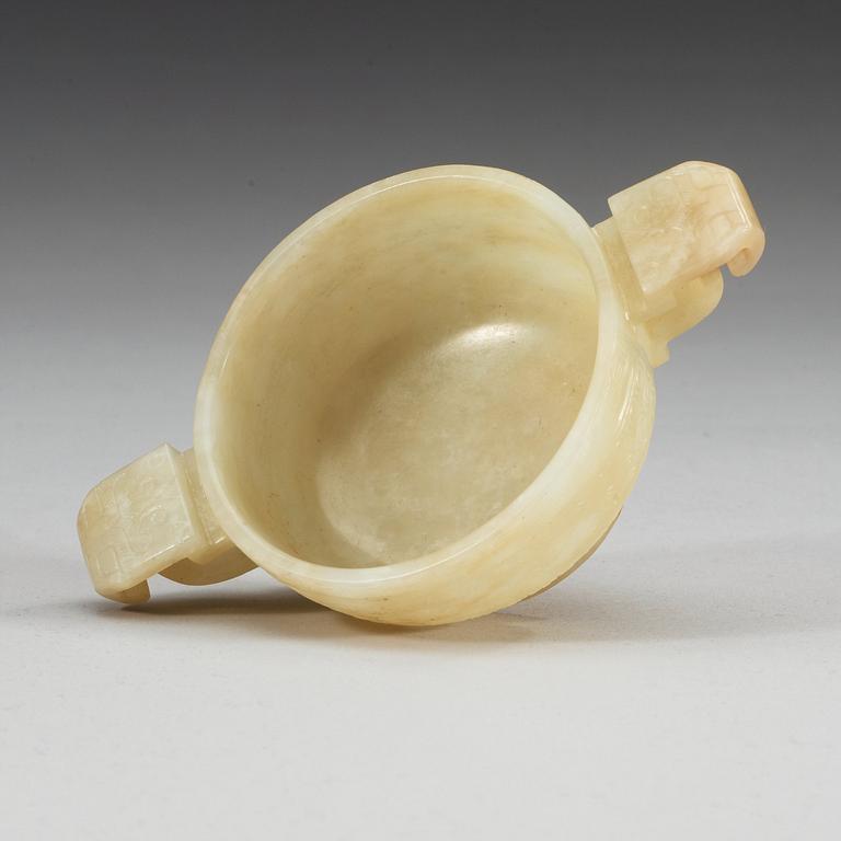 A carved nephrite cup, China.