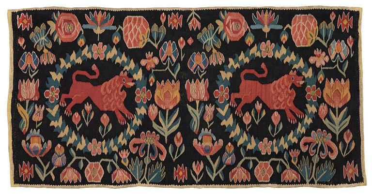 A cushion, 'Red Lion' (Rött Lejon), tapestry weave, c. 98 x 49 cm, Southwestern Scania, first part of the 19th century.