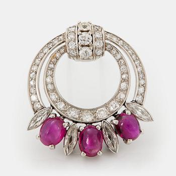 1036. A platinum brooch set with cabochon-cut rubies and navette-, eight- and old-cut diamonds.