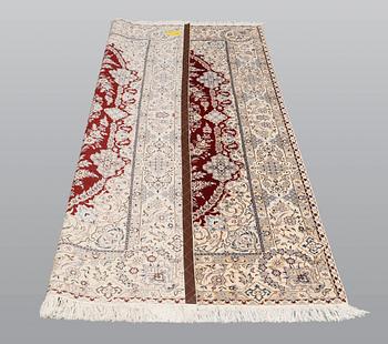 A carpet, Nain part silk s.k 6LAA, 239 x 155 cm.