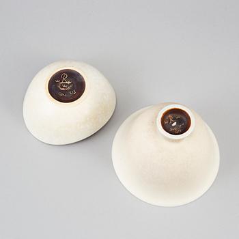 GUNNAR NYLUND, three stoneware vases and two stoneware bowls, Rörstrand, Sweden.