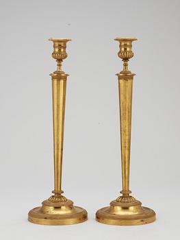 A pair of French Empire early 19th century candlesticks.