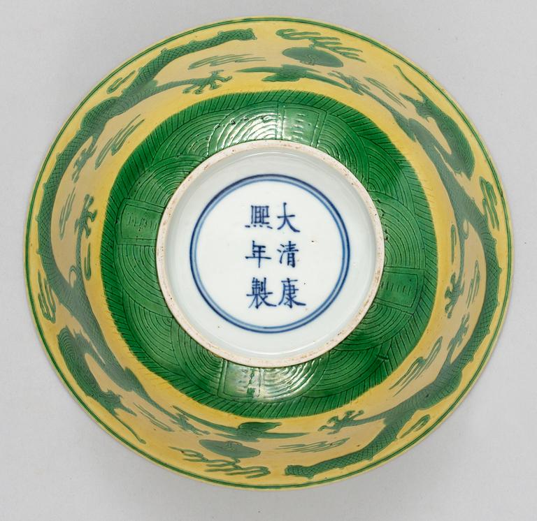 A pair of yellow ground 'dragon bowls', Qing dynasty, with Kangxis six character mark.