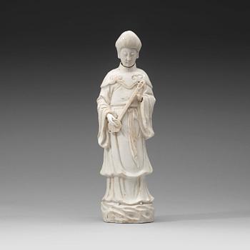 A blanc de chine figure of a court attendant, Qing dynasty, Kangxi ca 1690.