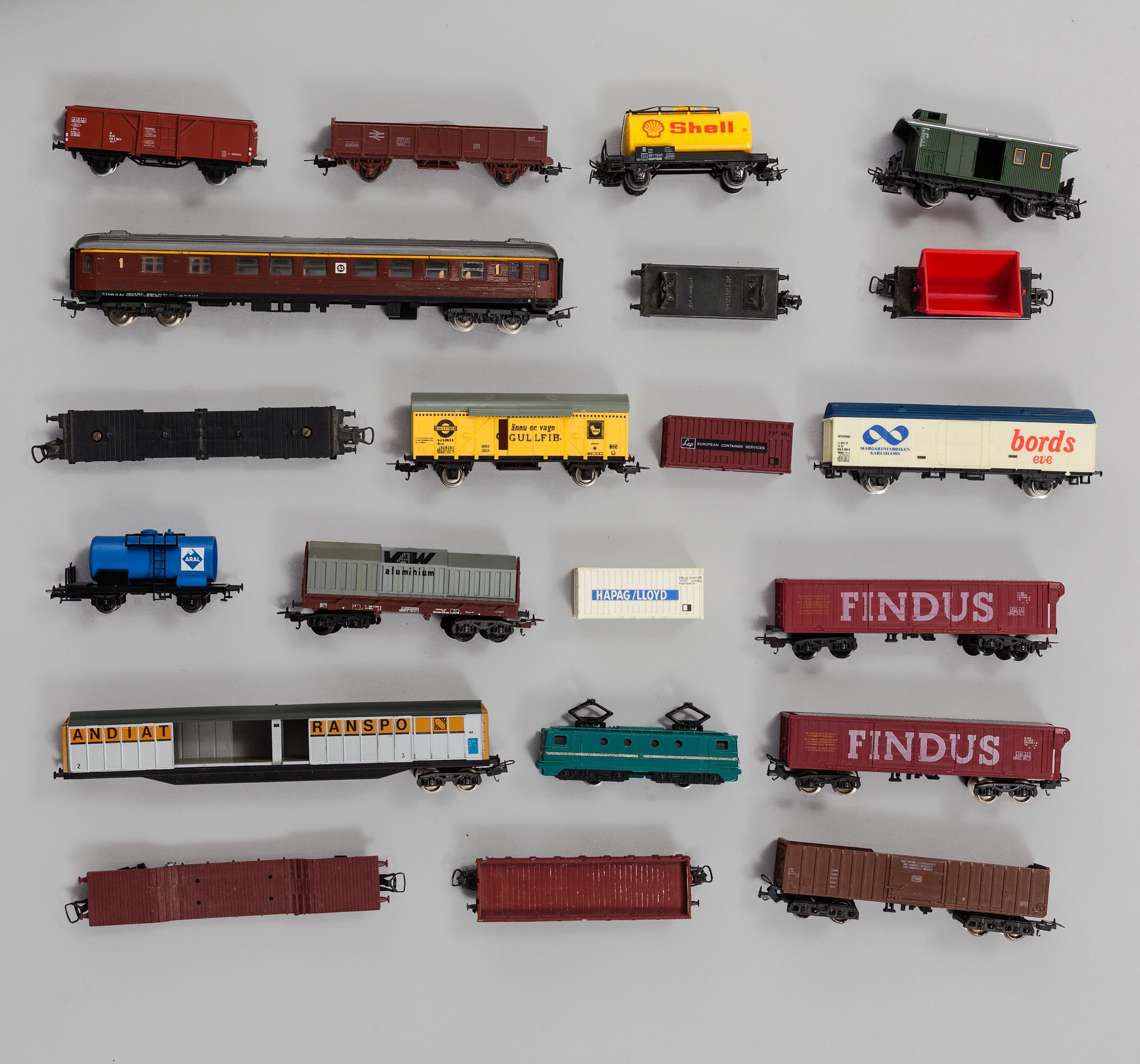 A model train set with locomotives, wagons, rail H0, Danish village houses, tunnel, mountain and more.