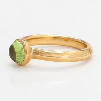 Georg Jensen, an 18K gold 'Moonrise' ring with a cabochon-cut peridot.