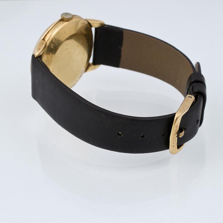 ARMBANDSUR, herr, boett i 18 k guld, "Genève", Omega, total vikt 38 g.