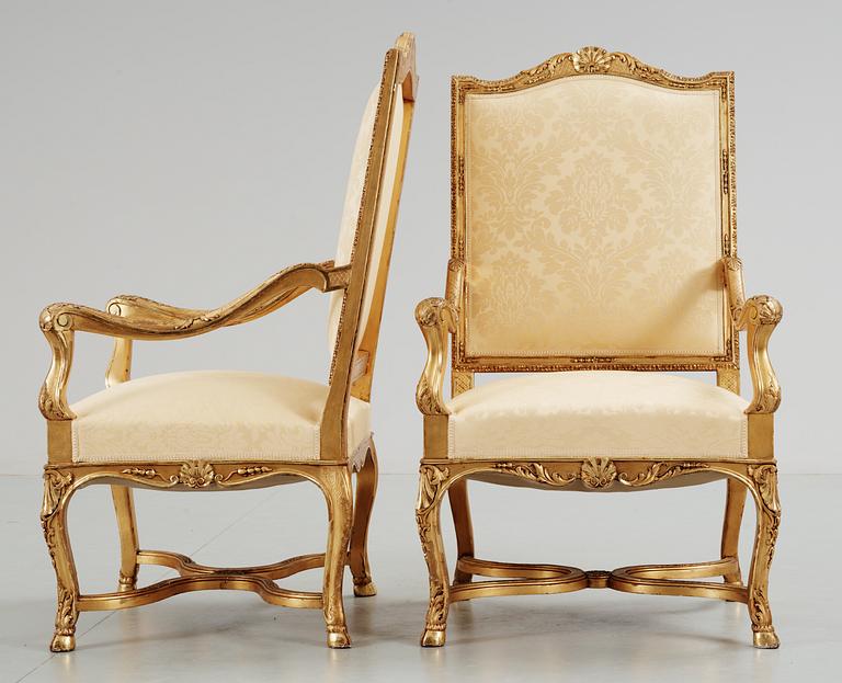 A pair of Régence-style circa 1900 armchairs.