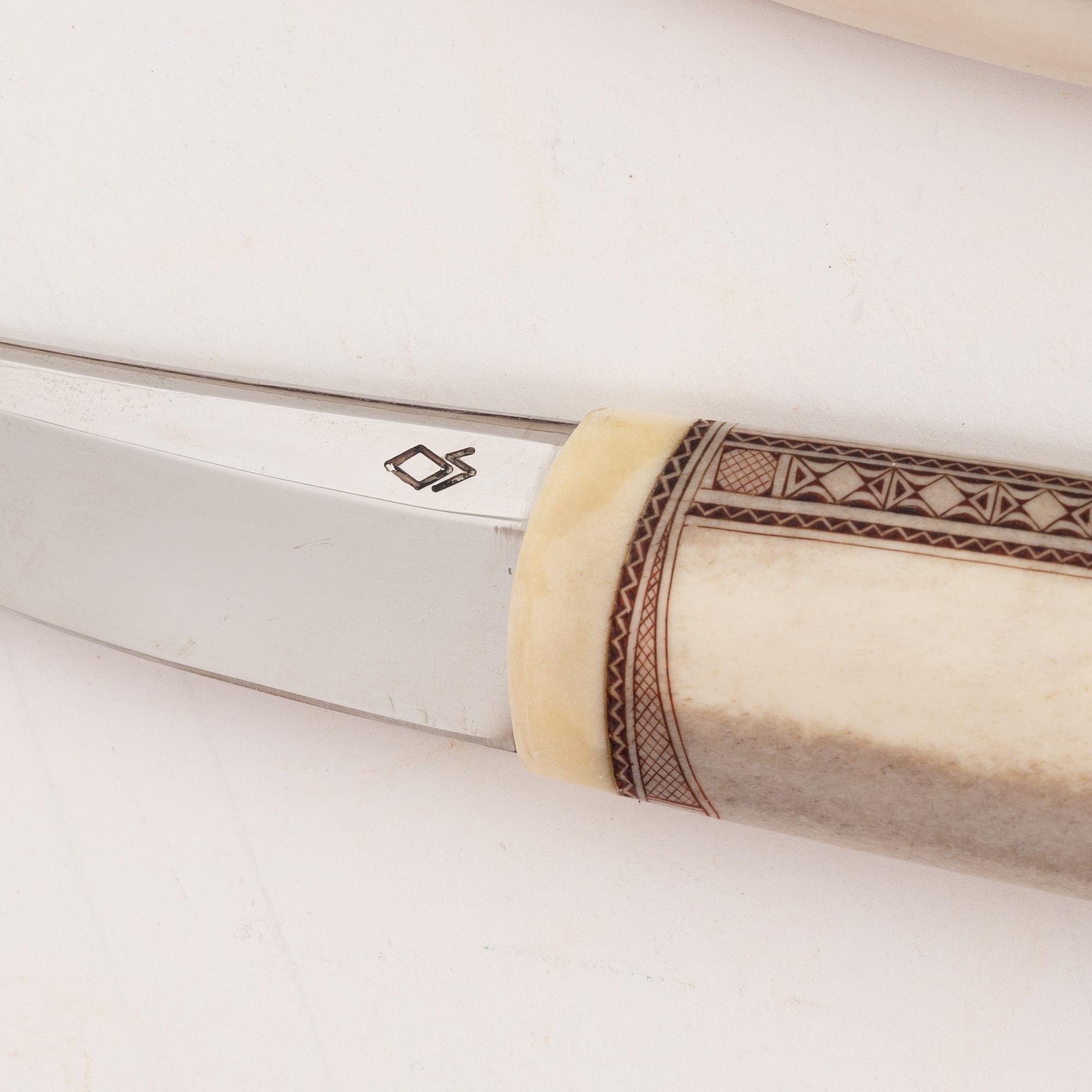 A reindeer horn knife by Olav Svonni, signed and dated 2000.