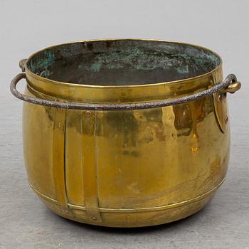 A large 19th century brass cauldron.
