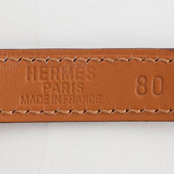 HERMÈS, a black leather belt.