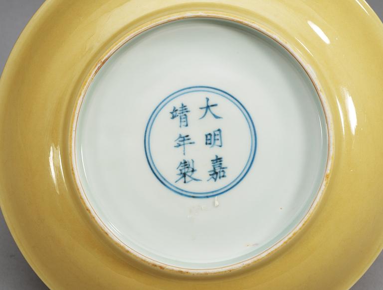 A Yellow glazed dish, Ming dynasty with Jiajings six character mark and period (1521-1567).