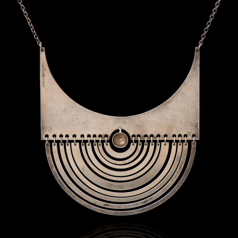 A TAPIO WIRKKALA PENDANT, "Half-Moon", silver. Kultakeskus 1972.