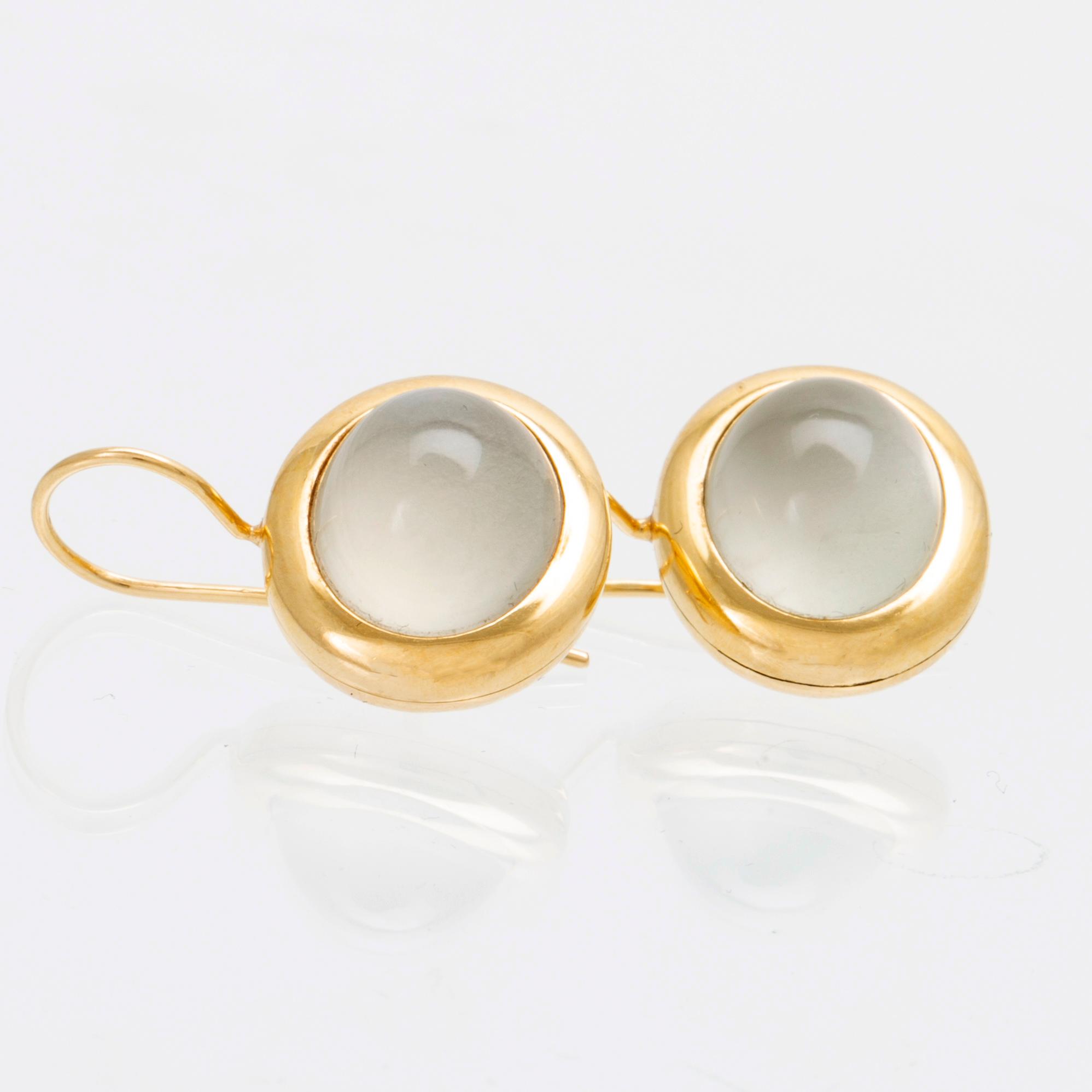 A pair of 18K gold earrings "Emeli" with cabochon-cut moonstone from Ole Lynggaard.