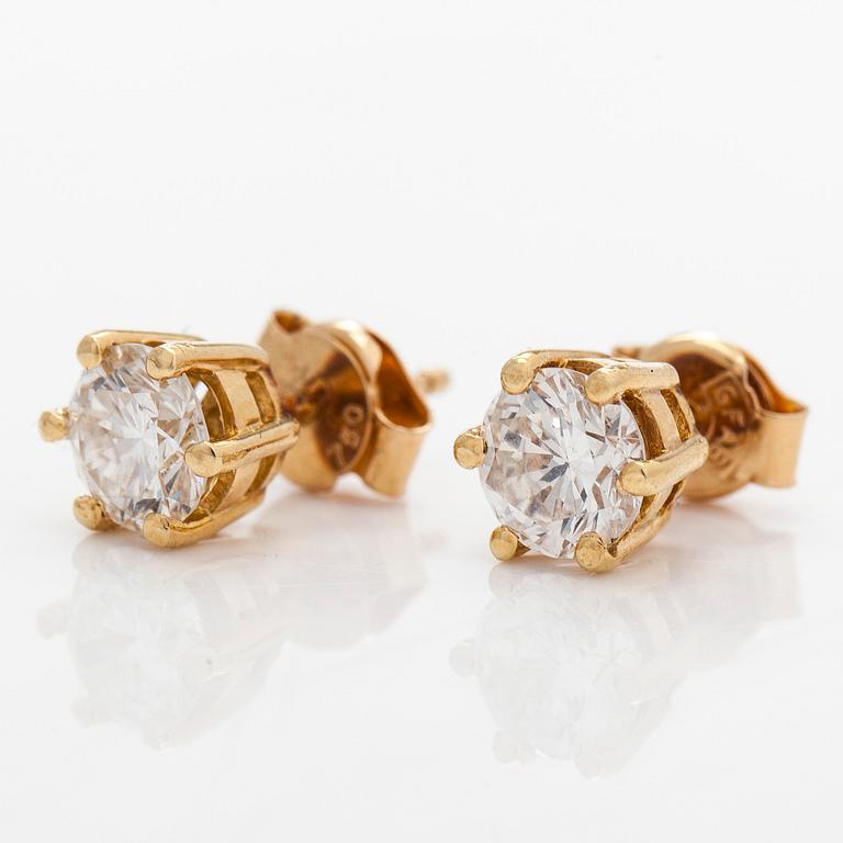 A pair of 18K gold earrings, with round brilliant-cut diamonds.