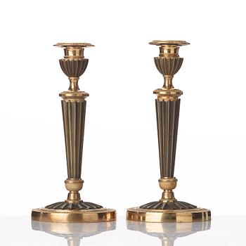 A pair of French Empire early 19th century candlesticks.