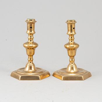 A pair of 17th century bronze candlesticks.