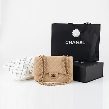 Chanel, A 'Classic Flap Jumbo' caviar leather bag, 2009-2010.