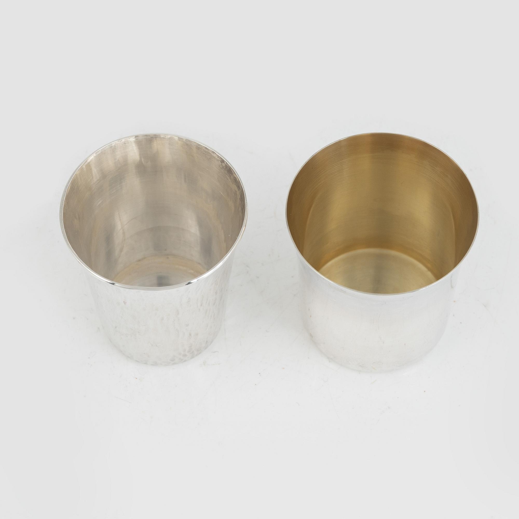 A set of 16 silver cups, including GAB, Stockholm 1964.