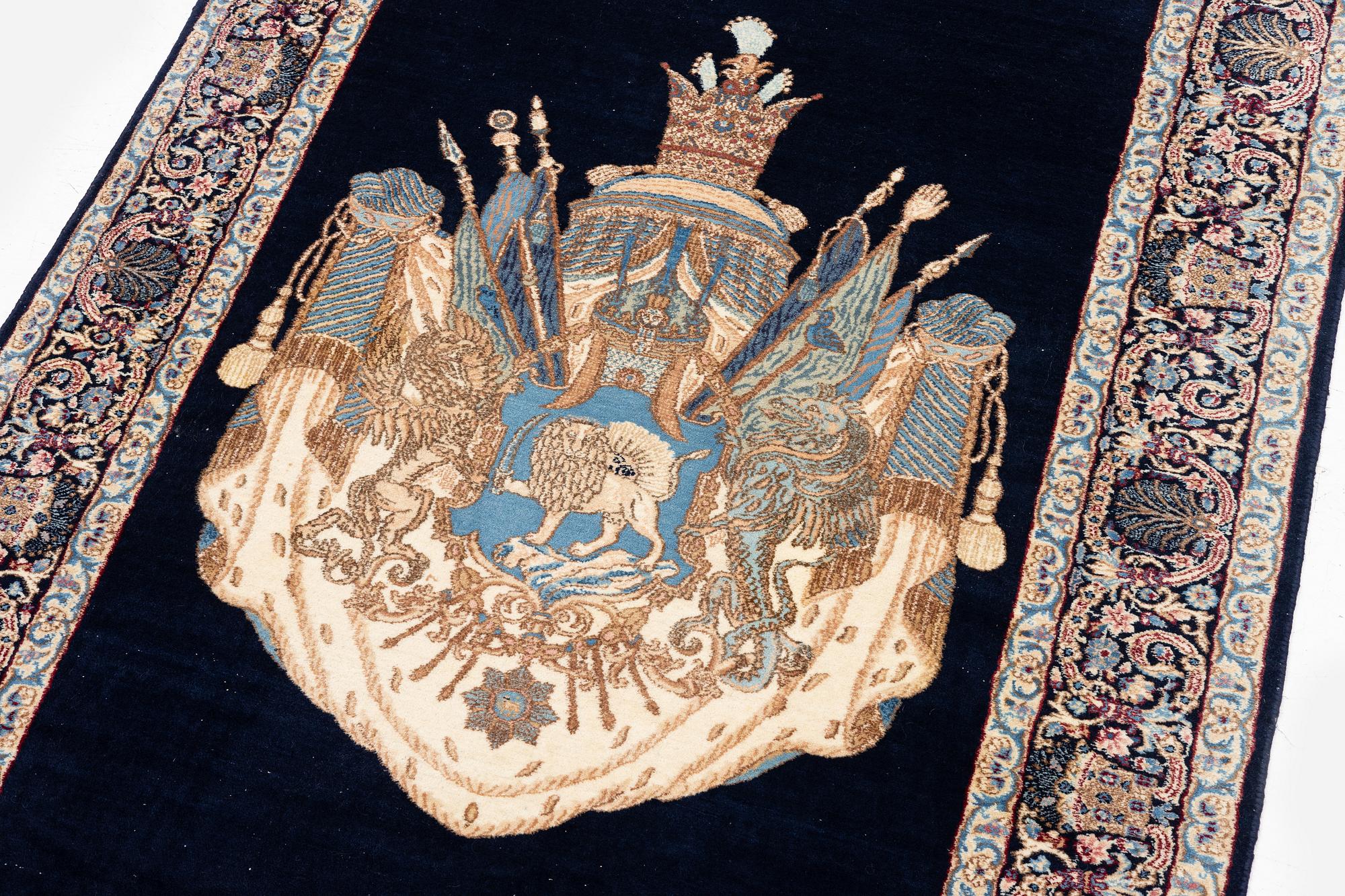 A semi-antique pictoral 'Lion and Sun' Kerman rug, c. 205 x 144 cm.