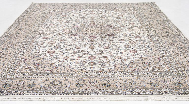 A Keshan carpet, signed, c. 405 x 290 cm.