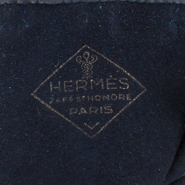 HERMÈS, a pair of blue leather gloves.