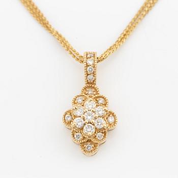 Pendant with chain in 14K gold set with round brilliant-cut diamonds.