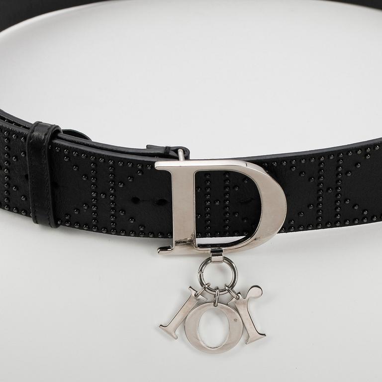 CHRISTIAN DIOR, a black leather belt.