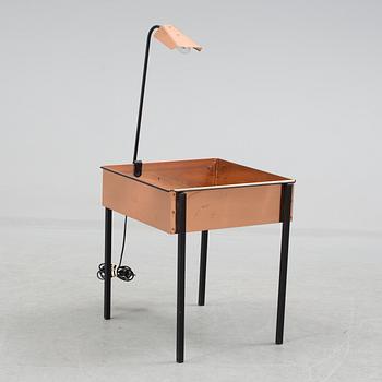 a flower table with a light by Gnosjö konstsmide in the second half of the 20th century.
