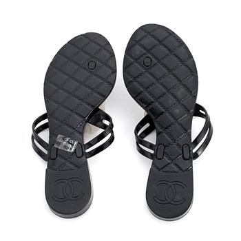 CHANEL, a pair of black plastic sandals. Size 38.