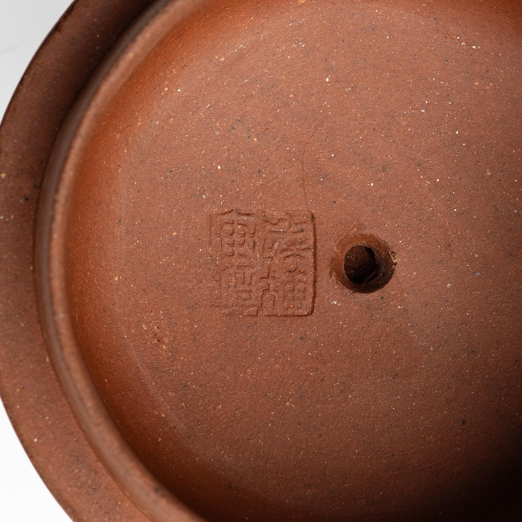 Two Chinese yixing teapots, early 1900s and 1980s.