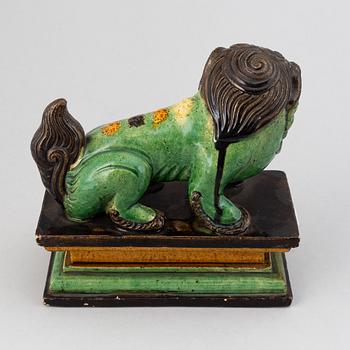 A green and yellow glazed buddhist lion, Qing dynasty, 19th Century.