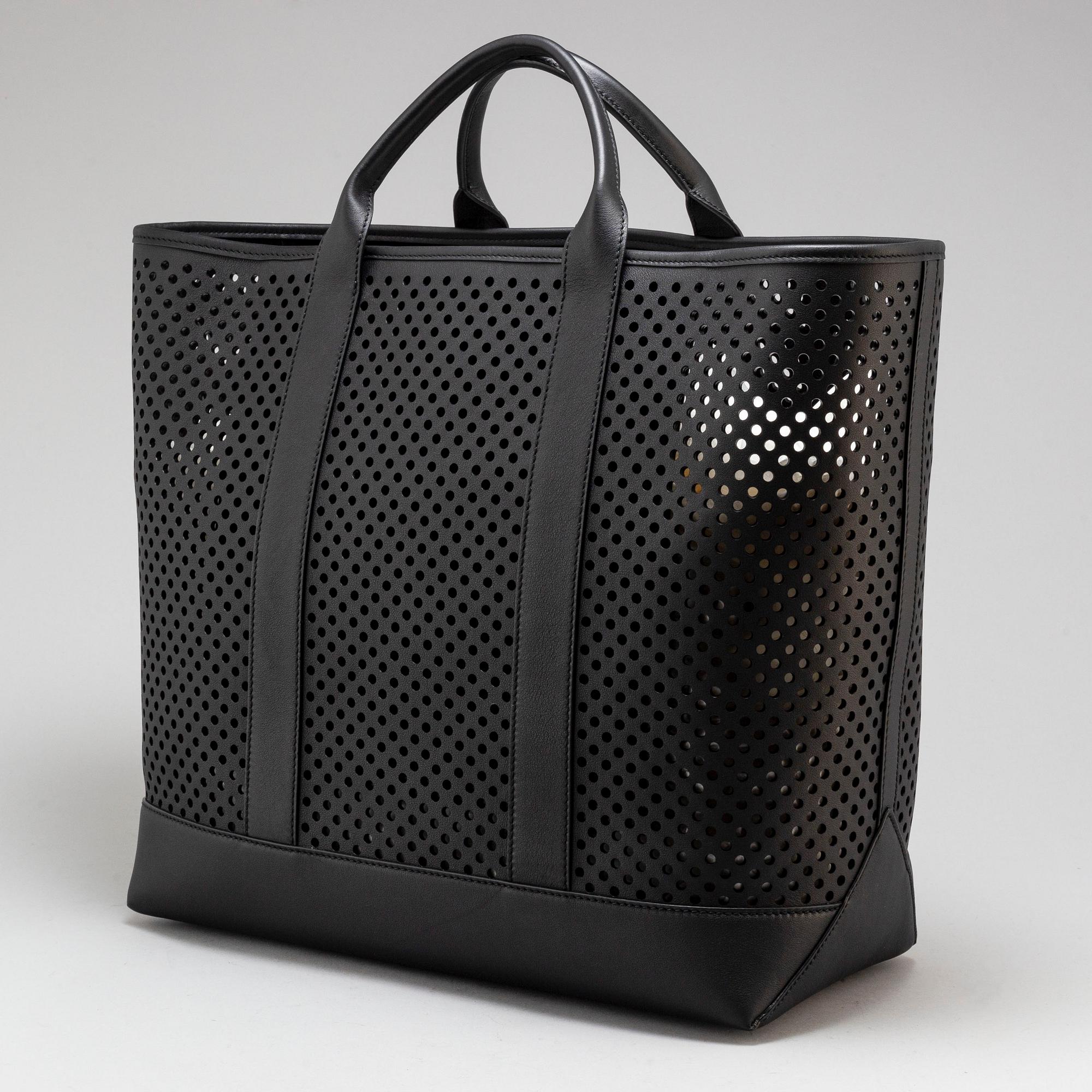 MICHAEL KORS a perforated black leather tote bag. Bukowskis