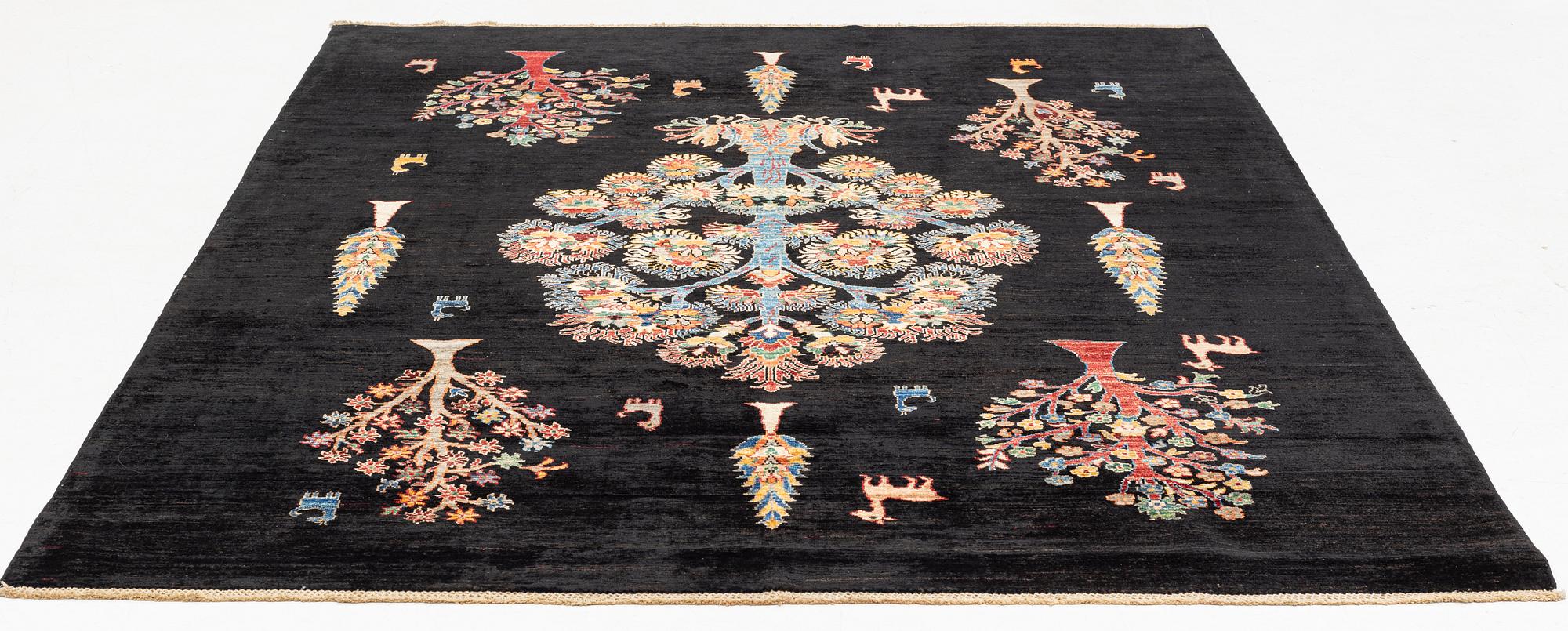 A figural oriental Carpet, circa 263 x 201 cm.