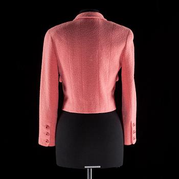 A pink bouclé jacket by Chanel.