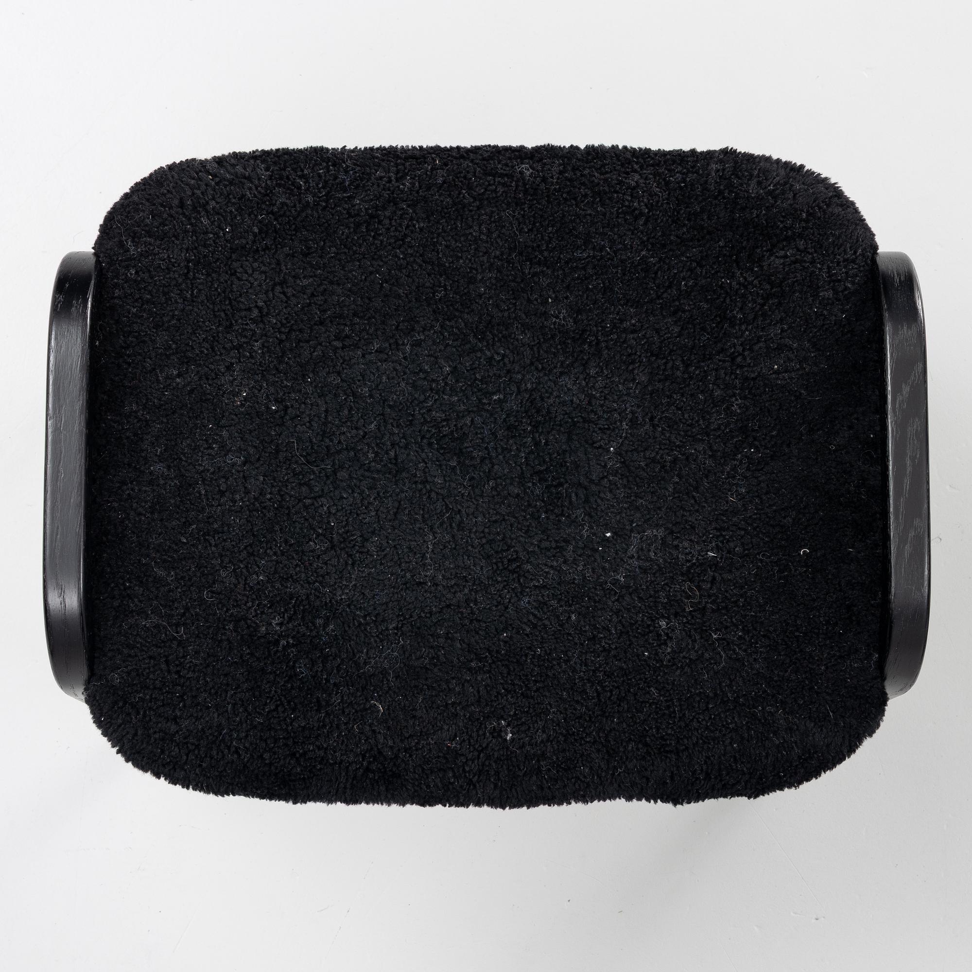 Yngve Ekström, a 'Lamino' easy chair with foot stool, Swedese 2010.