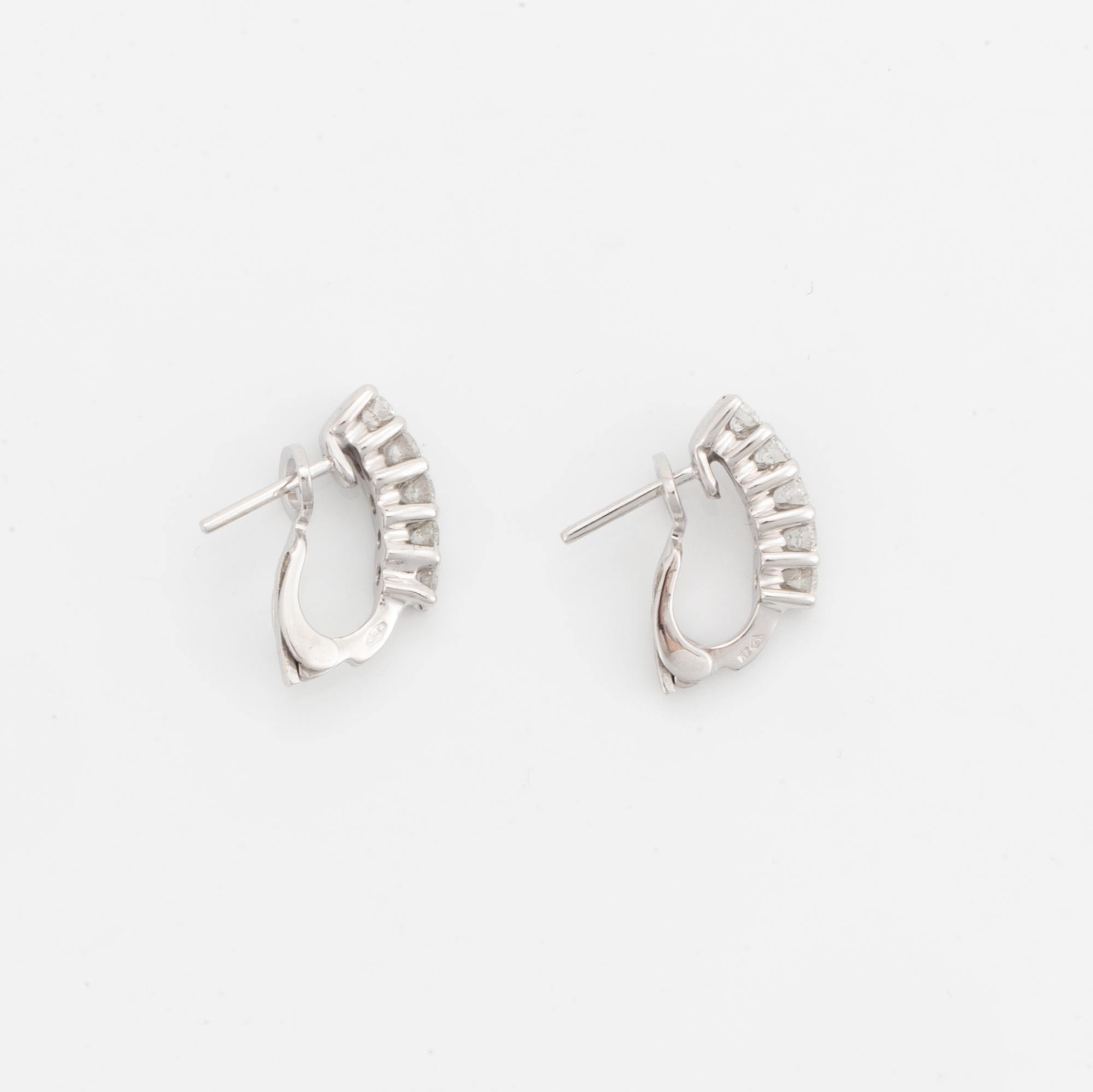 Brilliant-cut diamond earrings.