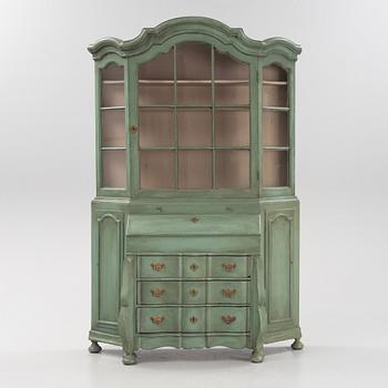 A Rococo cabinet with vitrine top.