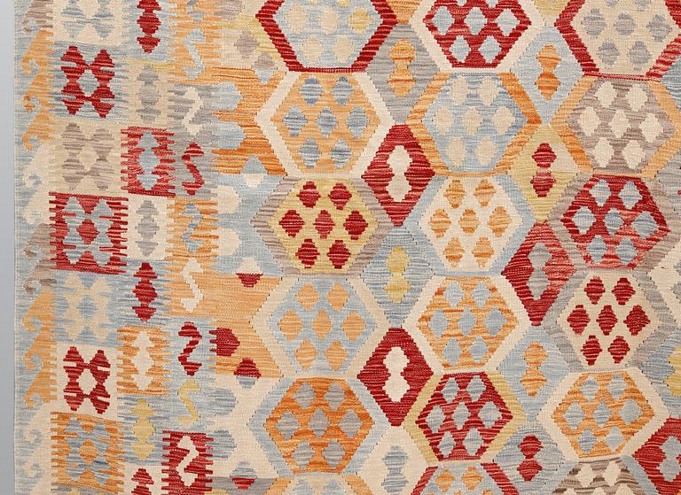 A kilim carpet, ca 340 x 259 cm.