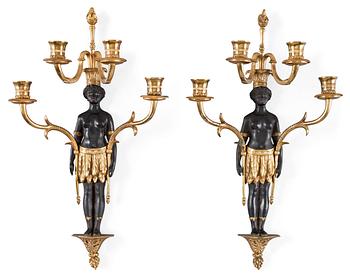 603. A pair of Empire-style circa 1900 four-light wall-lights.