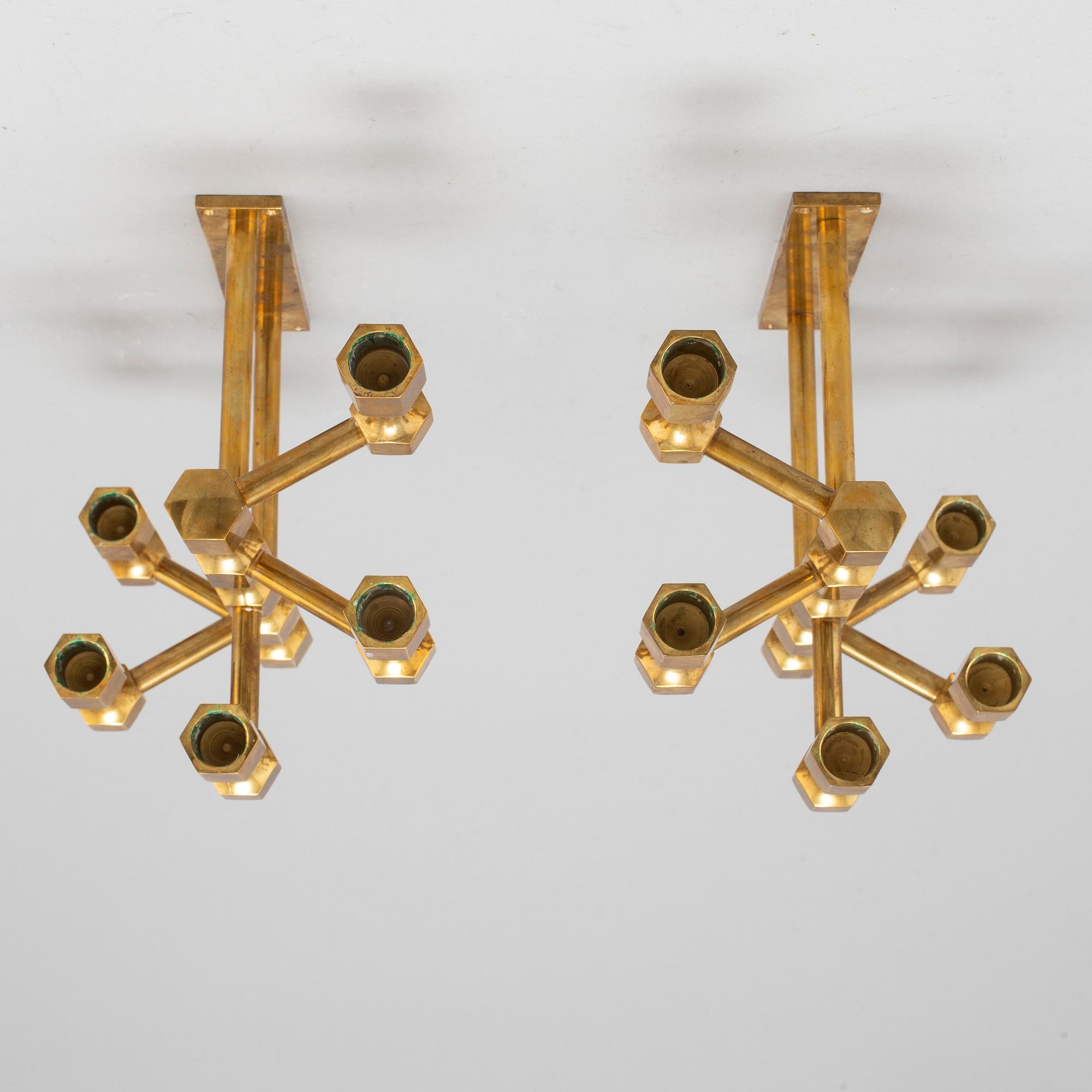 A pair of brass wall candelabras, for Gusum, signed BK and dated 1995 and 1997.