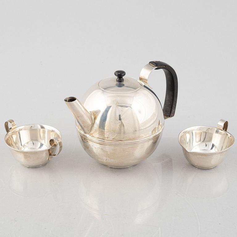 A Swedish Art Déco Silver Coffee Pot, Creamer and Sugar Bowl, mark of CG Hallberg, Stockholm 1936.