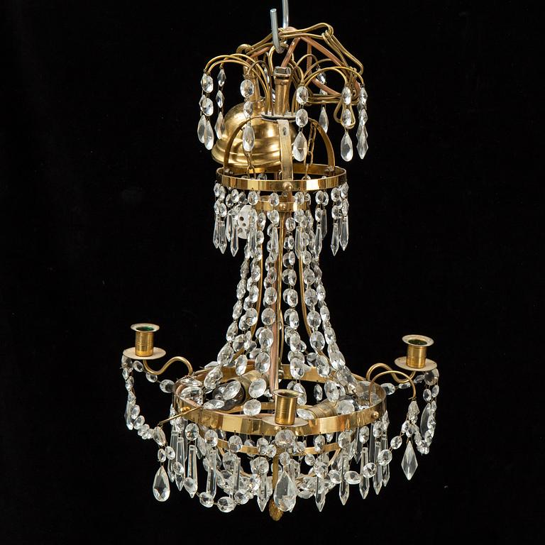 A small Swedish 20th century empire style chandelier for three candles.
