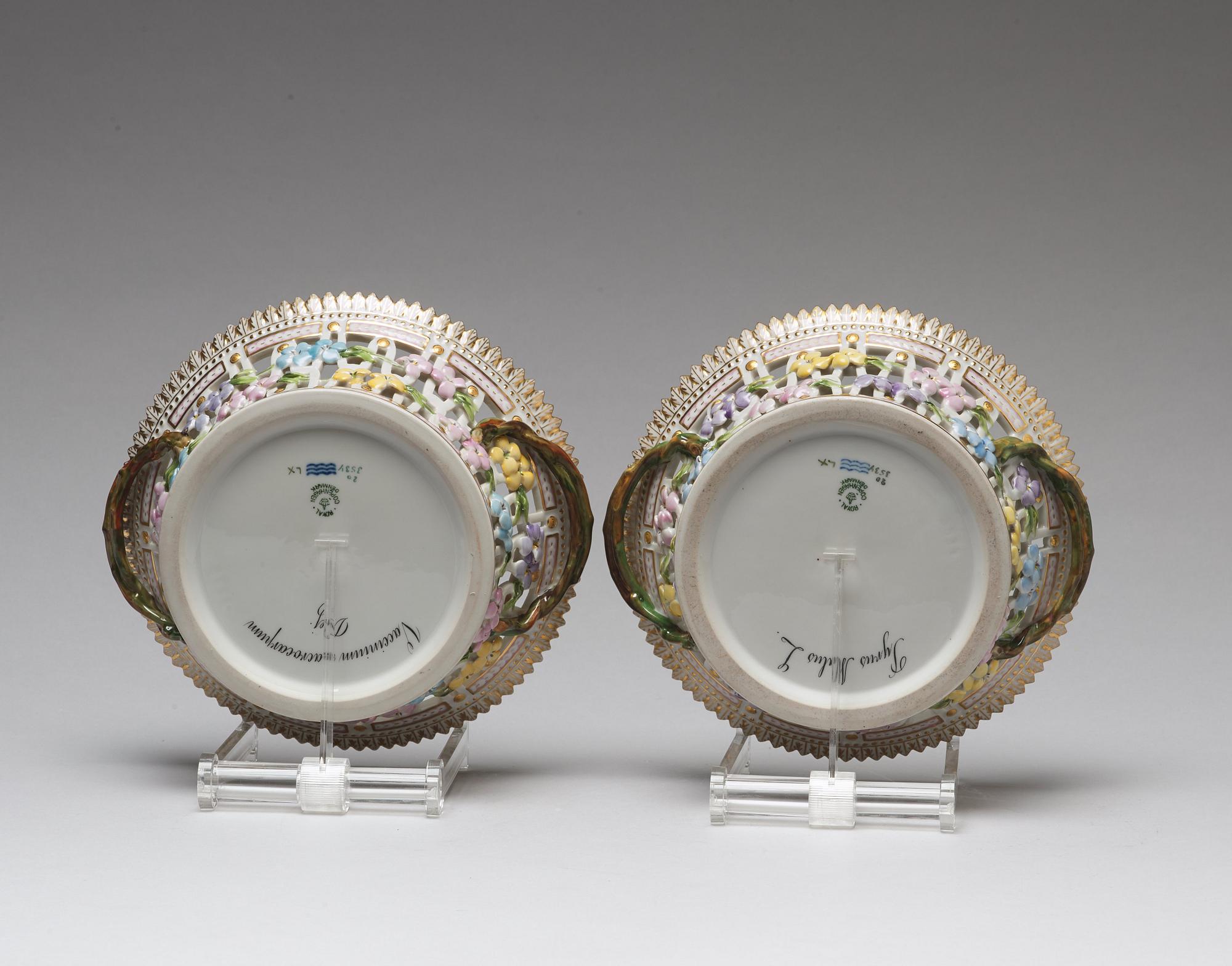 A pair of Royal Copenhagen "Flora Danica" chesnut baskets with stands, Denmark, mid 20th Century.