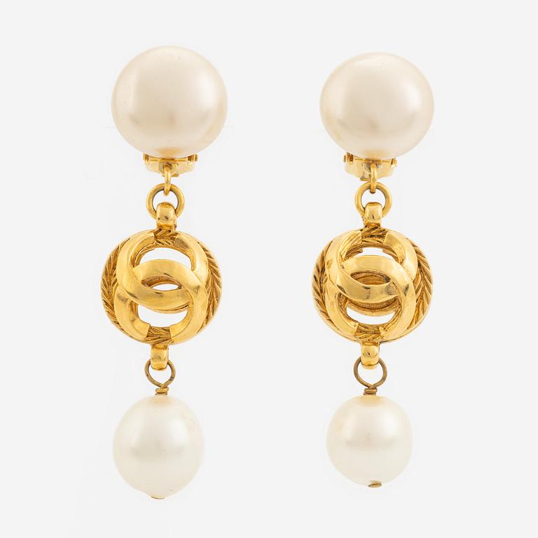 Chanel, a pair on gold tone and pearl clip-on earrings.