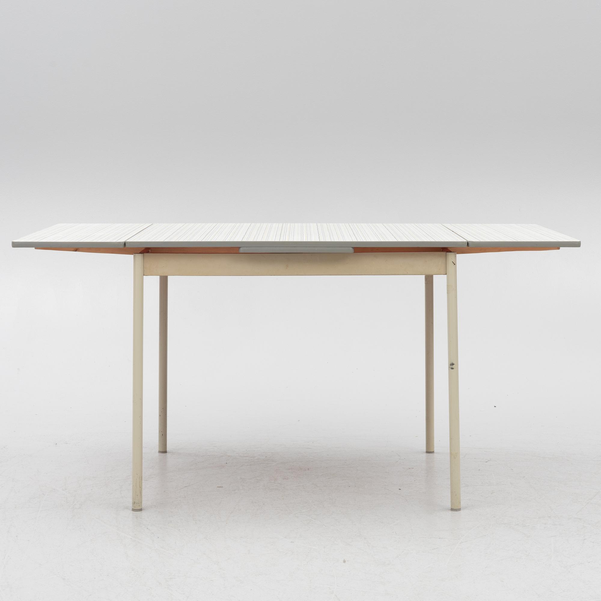 A table and four chairs, mid-20th Century.