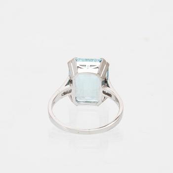 A platinum ring set with a square step cut aquamarin and single cut diamonds CG Hallberg Stockholm 1948.