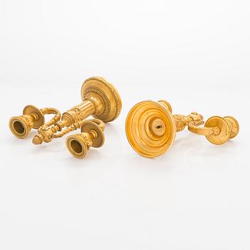 A. Rislef & Carré, a pair of brass candelabra, Paris, around 1900.