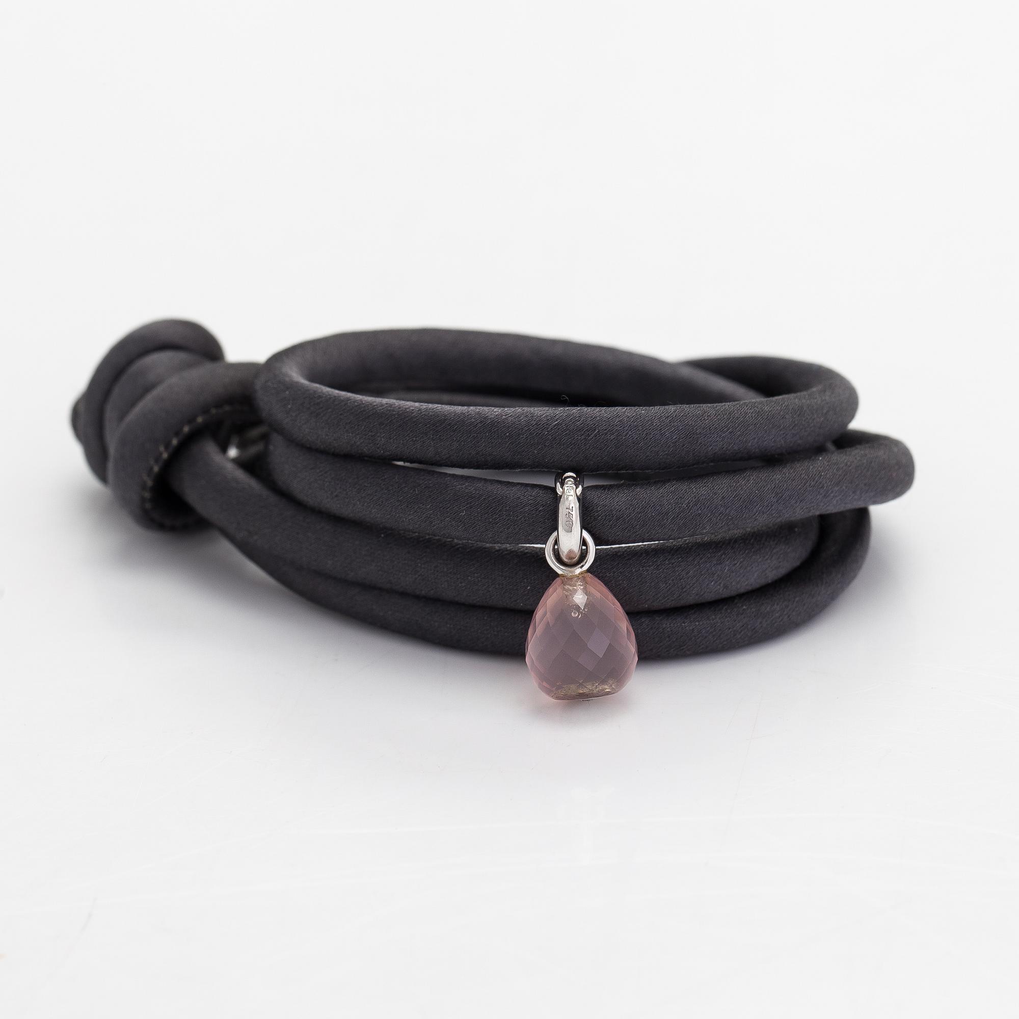 Ole Lynggaard, A silk, rose quartz, diamond 0.015 ct and 18K white gold bracelet. Denmark.
